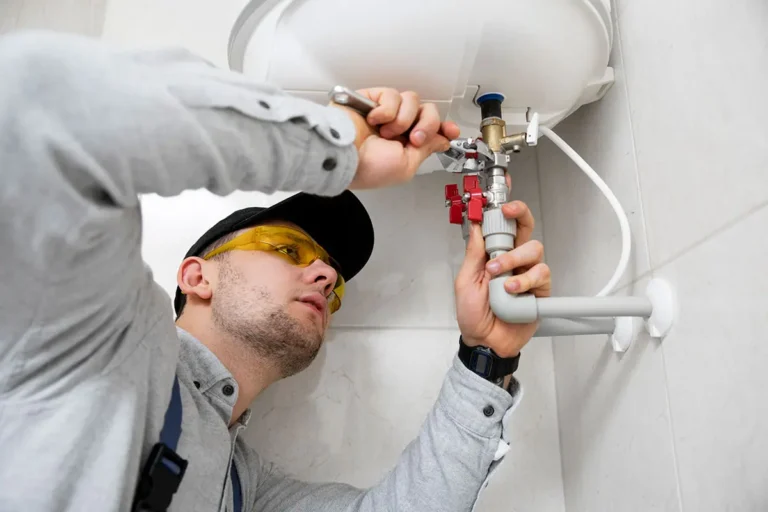 soul plumbing worker repairing water heater